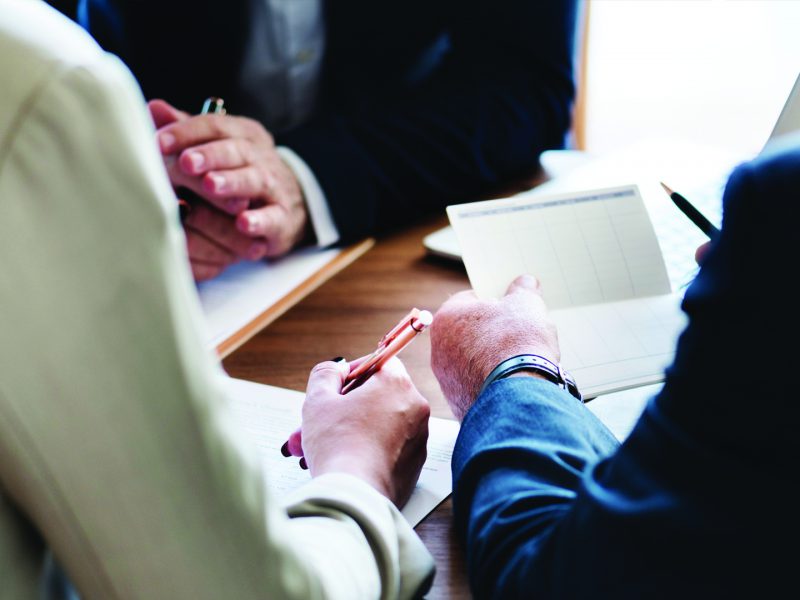 Lawyers discussing litigation strategies before trial